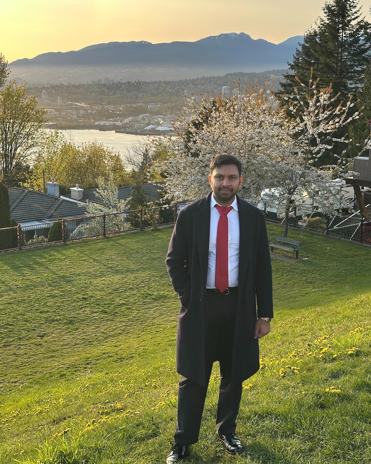 Harsh Gupta in a garden overlooking the mountains