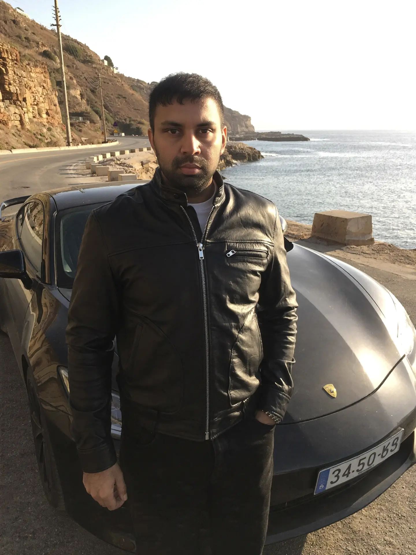 Harsh Gupta by a coastal road